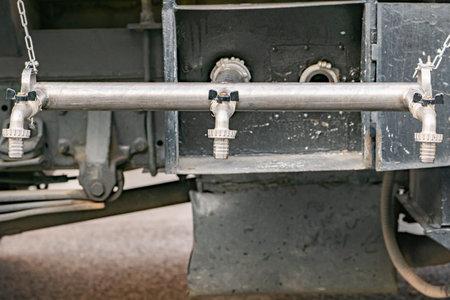Water tank truck plumbing system distributing liquid using multiple taps