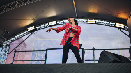 Moscow, Russia - August 25, 2025: Indian woman dancing on stage during India Day festival in Moscow