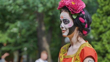 Moscow, Russia - July 5, 2025: Woman wearing Catrina makeup celebrating Day of the Dead with painted...