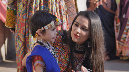 Delhi, India - September 19, 2025: Indian mother and child celebrating Ganesh Chaturthi festival in traditional attireのeditorial素材