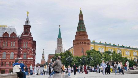 Moscow, Russia - August 17, 2025: Tourists enjoying sunset at Red Square Moscow, viewing State...