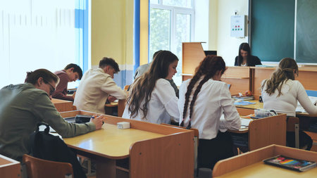 Berezovka, Belarus - May 15, 2023: High school seniors in the classroom.