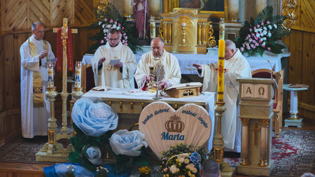 Trokeli, Belarus - April 17, 2022: Priests celebrating mass in Trokiele church