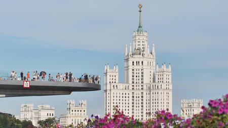 Moscow, Russia - August 25, 2025: Flying Bridge in Zaryadye Park with Kotelnicheskaya Embankment Buildingのeditorial素材