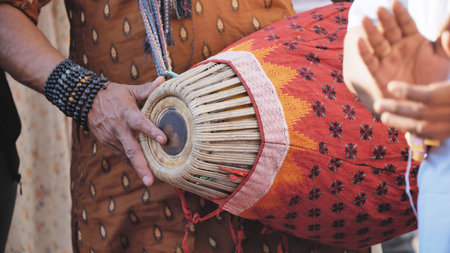 Delhi, India - September 19, 2025: India Ganesha festival musician playing traditional Madal drumのeditorial素材