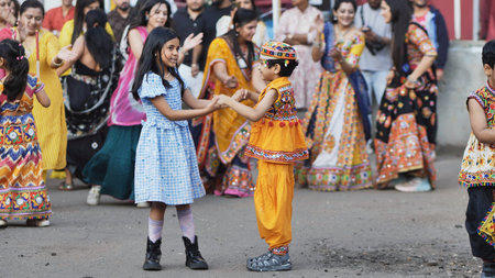 Delhi, India - September 19, 2025: Children celebrating Ganesh Chaturthi dancing traditional garba...