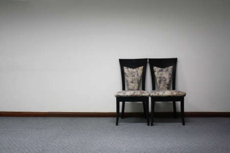 two chairs in white roomの写真素材
