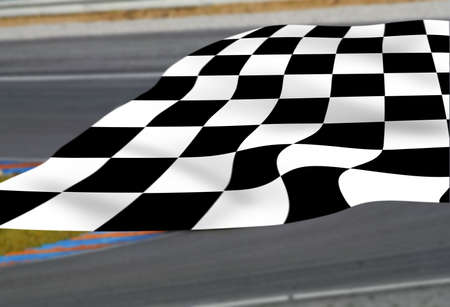 Chequered flag on racetrackの写真素材