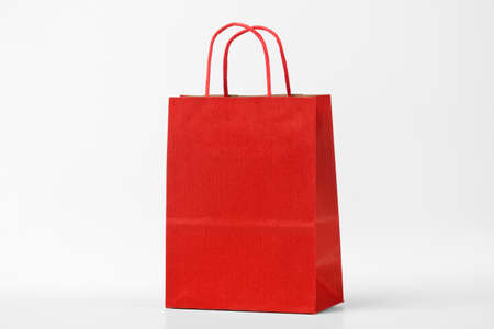 Red shopping bag on white.の写真素材