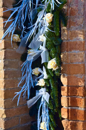 White roses near a door of a  Catholic Church.の写真素材