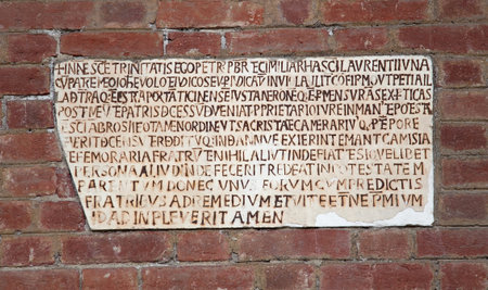 Basilica of Sant'Ambrogio (379-386), Milan, Lombardy, Italy: gravestone in the atrium, on the left.のeditorial素材