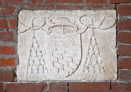 Basilica of Sant'Ambrogio (379-386), Milan, Lombardy, Italy: cardinal's coat of arms, in the atrium, on the left.のeditorial素材