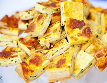 Pieces of omelettes on a plate.
