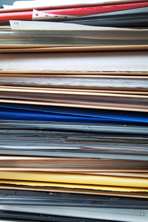 Stack of hanging file folders and documents,