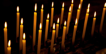 Alight candles over the black background.