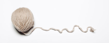 Beige wool ball on white