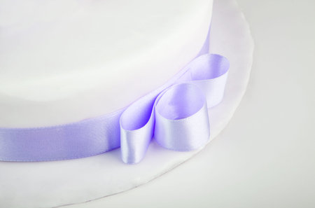 Detail of Blue ribbon on wedding cakeの写真素材