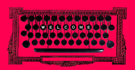 Welcom spelled on a vintage keyboard on redの写真素材