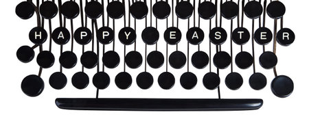 Happy Easter spelled on a vintage keyboard on white