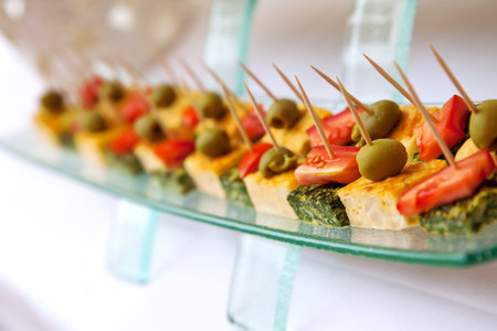 Finger foods (tomatoes, olives, omelets, focaccia)