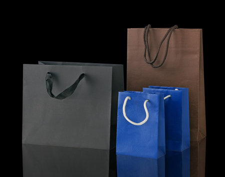 Several shopping bags isolated on black.の写真素材