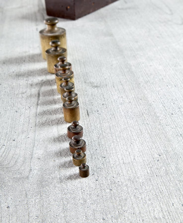 Old metal wights in row with space for your logo or textの写真素材