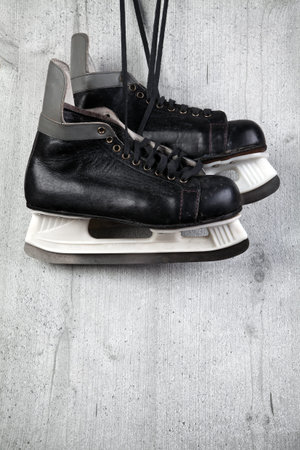 Vintage male ice skate on wood background
