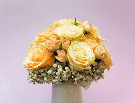 Bridal Bouquet of yellow roses on pink, fuchsia backgroundの写真素材