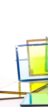 Several colored old glasses in lightの写真素材