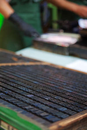 Detail of typographic letters. A worker on backgroundの写真素材