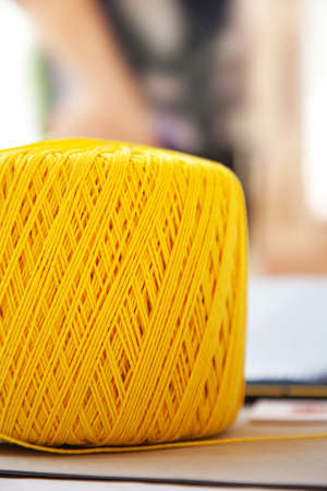 Detail of yellow ball of cottonの写真素材