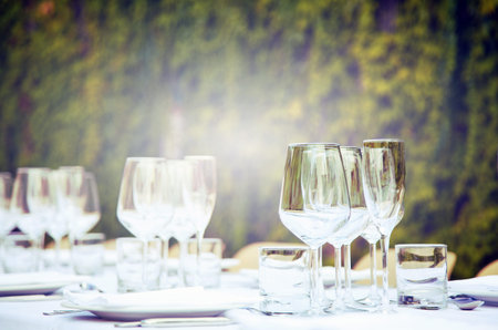 Table set in a garden. Vintage tone and selective focus.