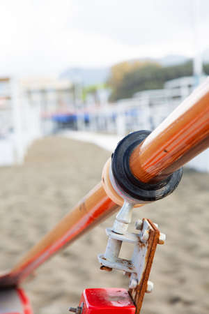 Detail of an oar and rowlock of a litlle boat on the beachの写真素材
