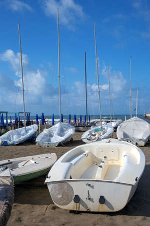 Beach of Forte dei Marmi, in Versilia, Italy. Sail boats in autumnの写真素材