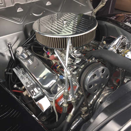 Restored chrome engine inside a classic carの写真素材