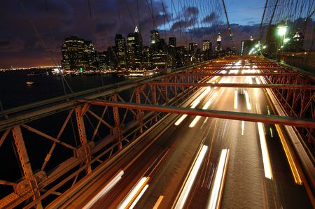 Cars on Brooklyn Bridge (Downtown Manhattan in the background)の写真素材