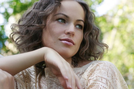 Portrait of beautiful woman on nature's backgroundの写真素材