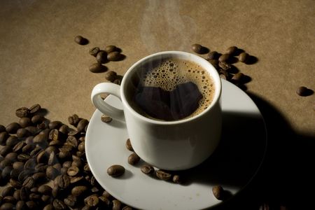 Cup of hot coffee with coffeebeansの写真素材