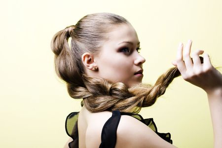 Elegant young blond girl. Profile viewの写真素材
