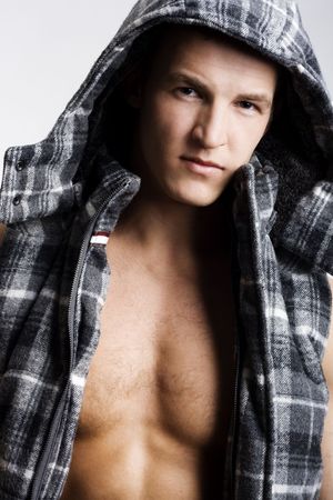 Beautiful young man posing on white backgroundの写真素材