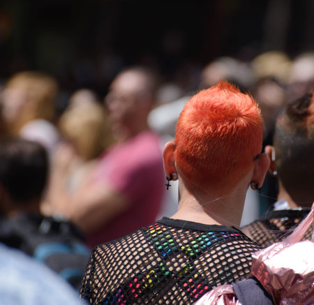 San Francisco, CA, USA - June 22, 2022: Pride Parade: Photo shows attendee with orange red hair...