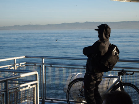 Early morning time to think looking out at blue waterの写真素材