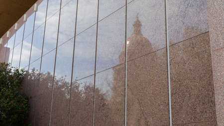 Photo of the Supreme Court building marble exterior reflecting the Texas capitol.のeditorial素材