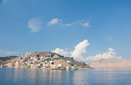 Gialos ( the lower harbour town ) and Chorio ( the upper town ) together form Symi town on the Greek island of Symi, near Rhodes in the Mediterranean sea. A quite beautiful, very tranquil, and highly colourful place. Many of the neoclassical homes were buの写真素材