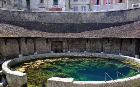 Tonnerre in the Morvan, Burgundy, France sits on the River Armancon. Famed for theTonnerre Fosse Dionne wash houseの写真素材
