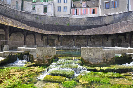 Tonnerre in the Morvan, Burgundy, France sits on the River Armancon. Famed for theTonnerre Fosse Dionne wash houseの写真素材