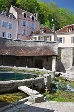 Tonnerre in the Morvan, Burgundy, France sits on the River Armancon. Famed for theTonnerre Fosse Dionne wash houseの写真素材
