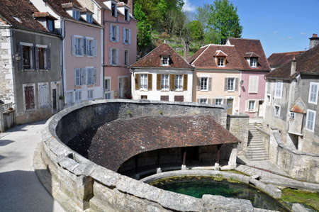 Tonnerre in the Morvan, Burgundy, France sits on the River Armancon. Famed for theTonnerre Fosse Dionne wash houseの写真素材