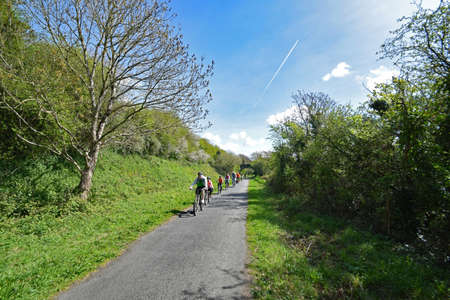 Barnstaple, Devon, England, UK - 11th April 2017. Enjoying a healthy day out by cycling on the Tarka Trail, a traffic free 30 mile cycle way and footpath near Barnstaple in North Devon, the route follows the rivers Torridge and Taw for much is its route.のeditorial素材