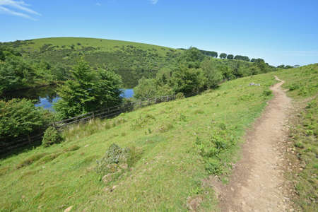 Public path along the shore at Meldon Reservoir on Dartmoor, England, Taken from Longstone Hill looking towards South Downの写真素材
